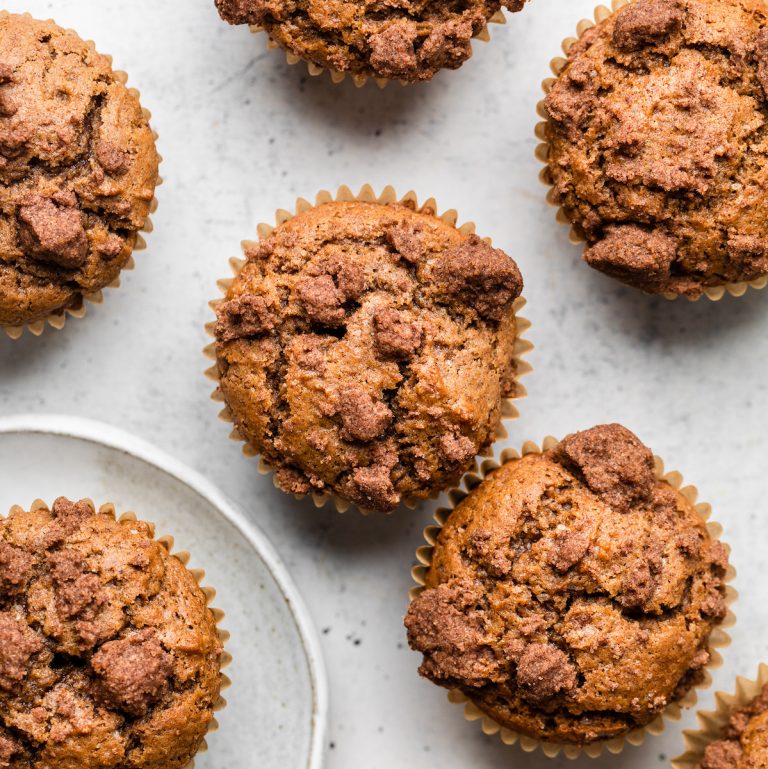 Apple butter muffins on a white table.