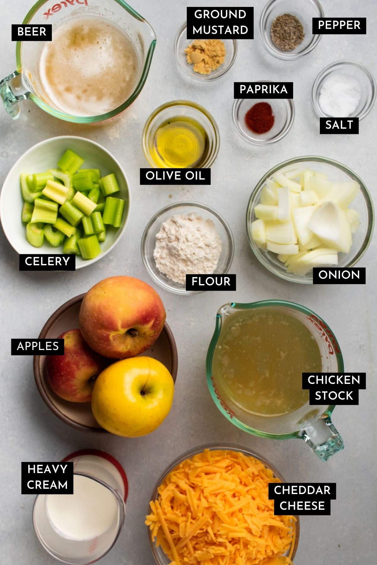 Apple beer cheese soup ingredients, organized into individual bowls.