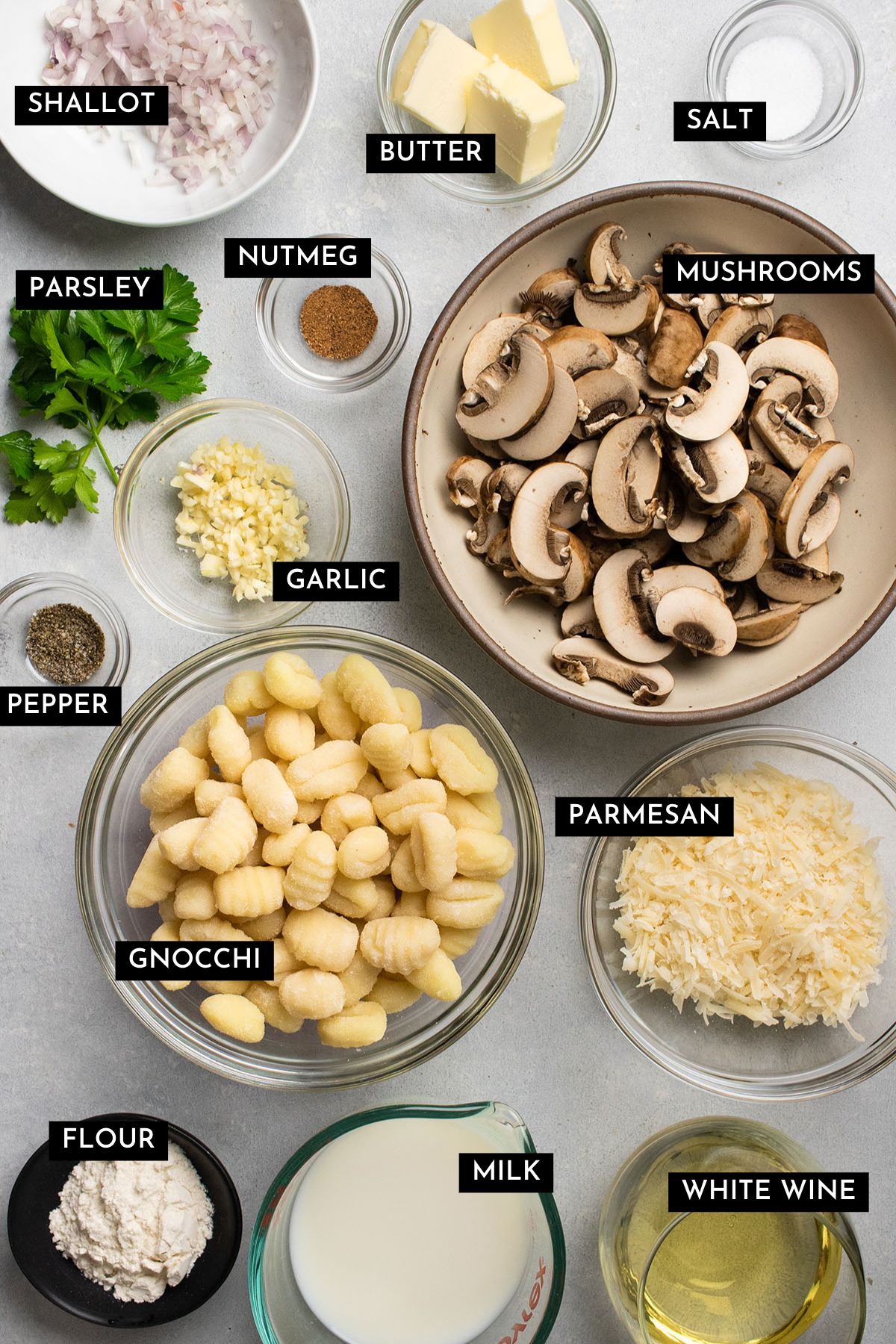 Mushroom gnocchi ingredients on a white table.