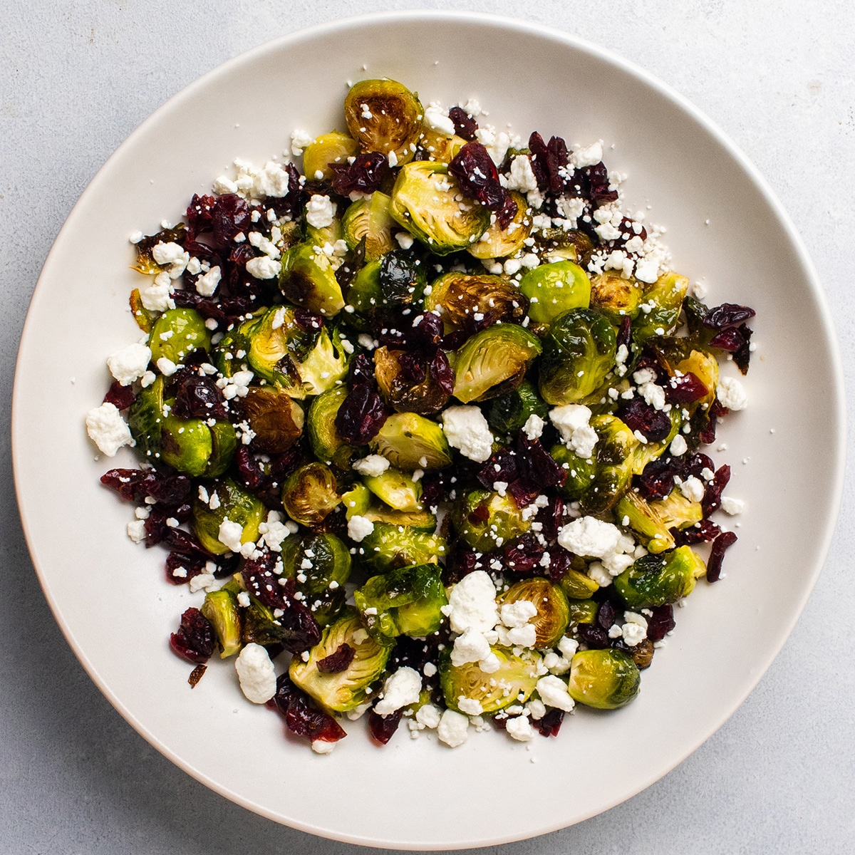 Maple Roasted Brussels Sprouts with Dried Cranberries and Goat Cheese - Life as a Strawberry