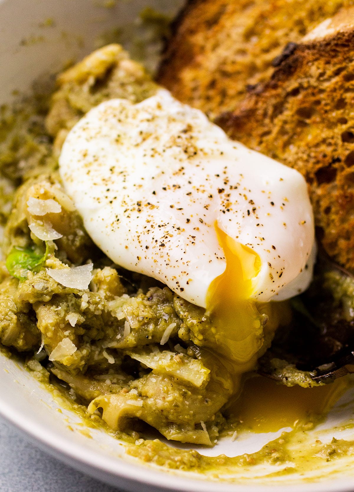 Poached egg on top of pesto butter beans.