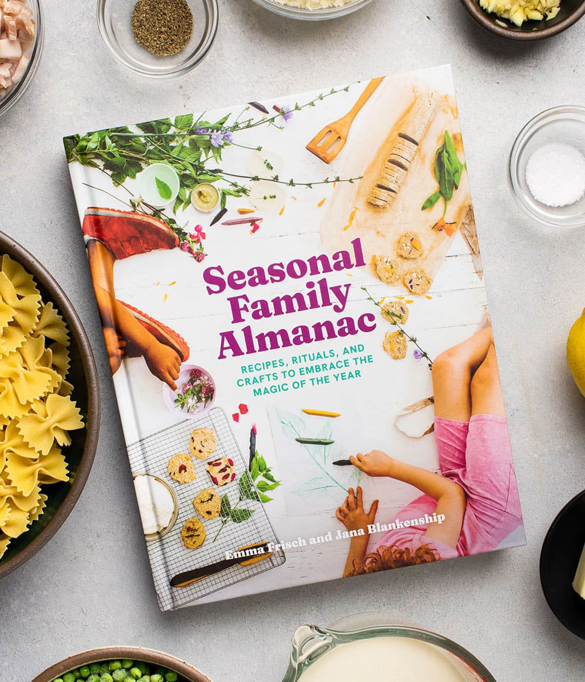 Seasonal family almanac cookbook on a white table.