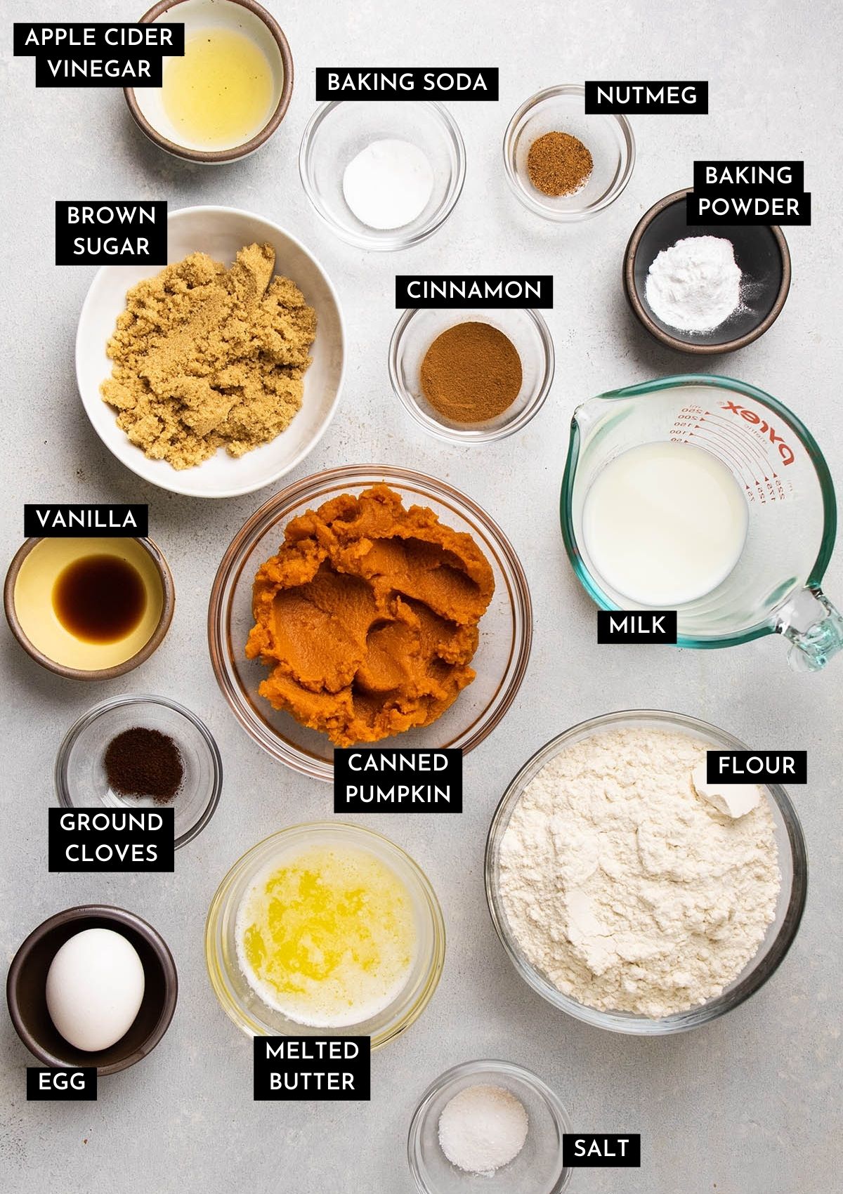 Pumpkin bread ingredients, organized into individual prep bowls.