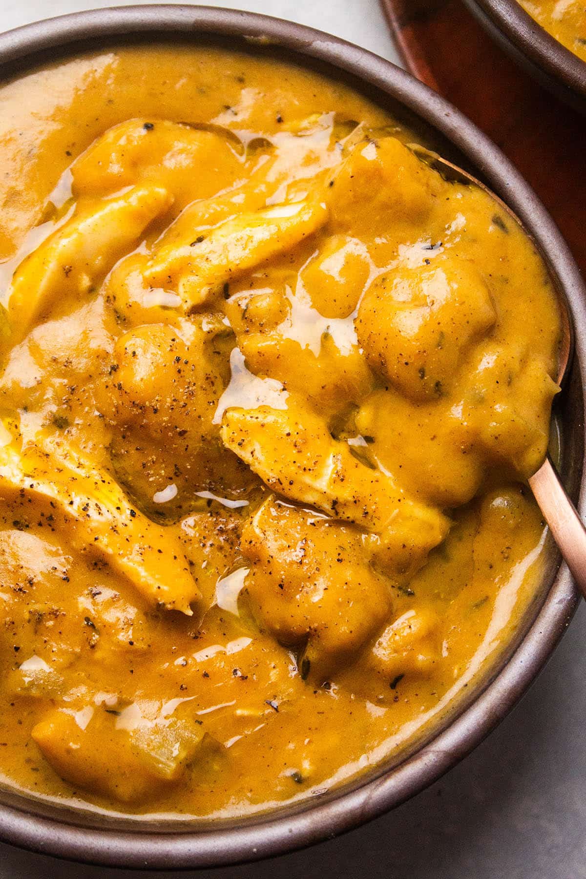 Spoonful of pumpkin soup. 