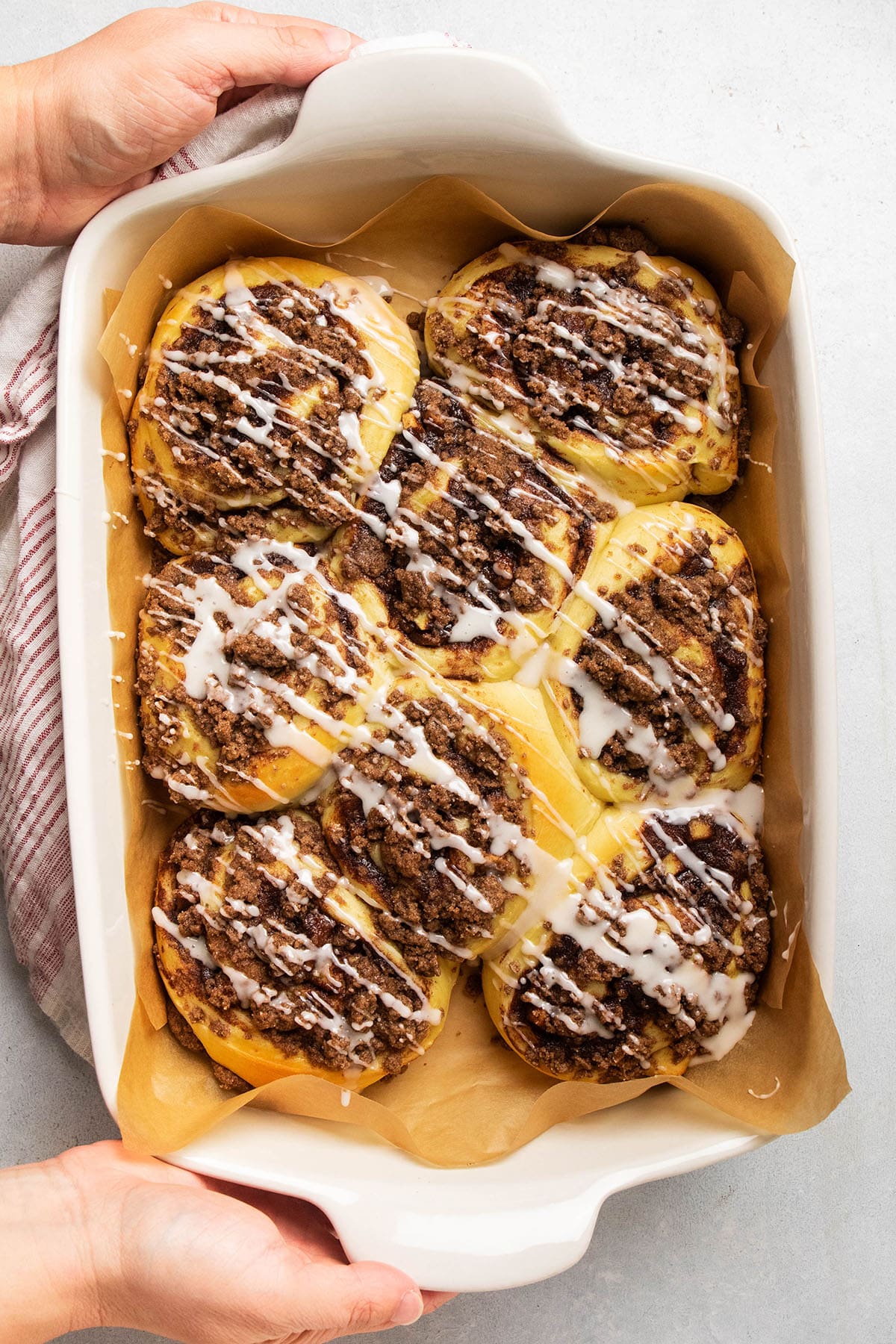 Apple pie cinnamon rolls topped with vanilla glaze.