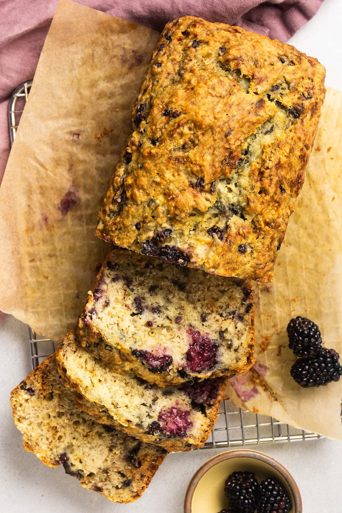 Slicing a loaf of banana bread.