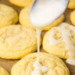 Drizzling lemon glaze over cookies.